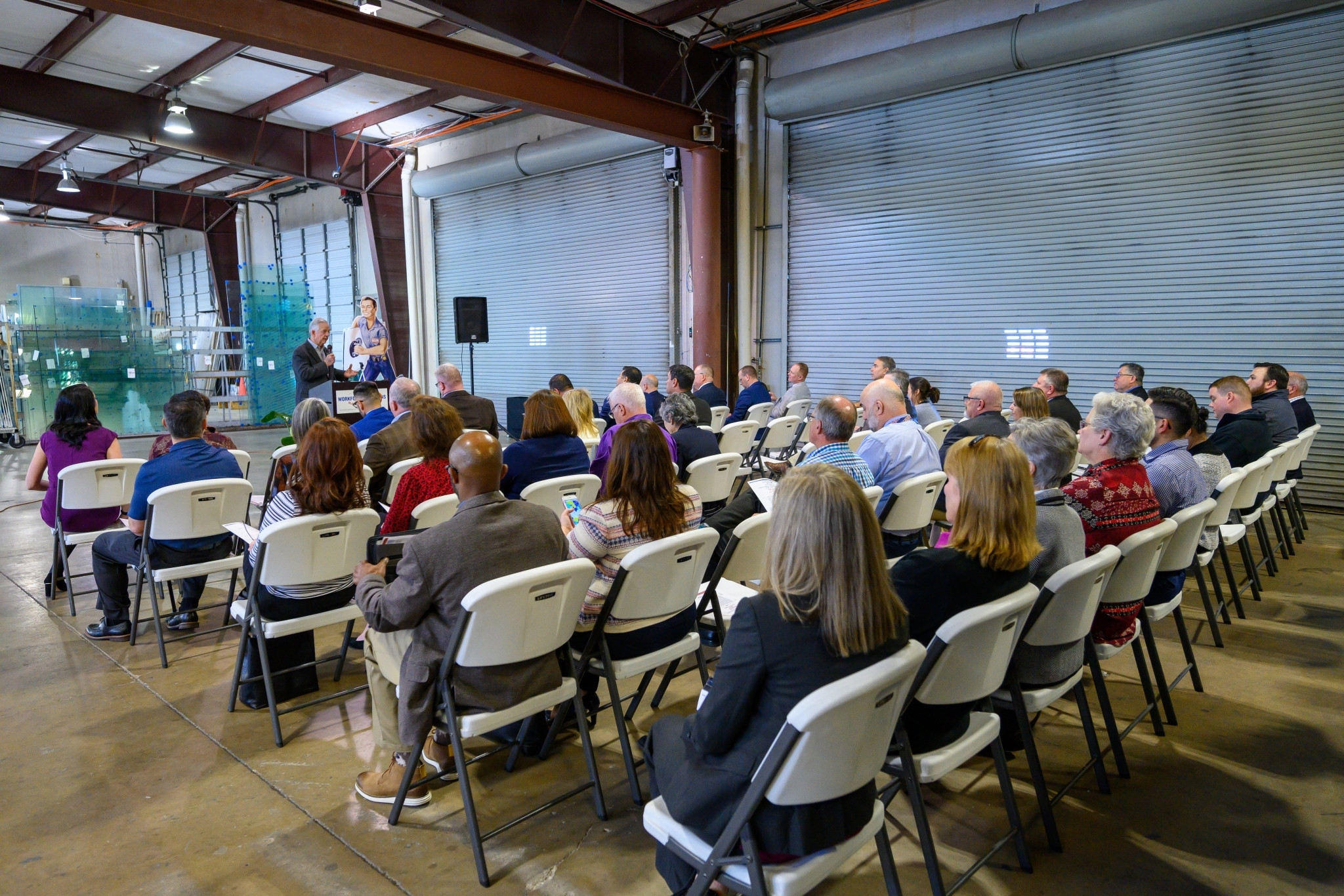 Felix Munson thanking the signing day guests for helping Anchor-Ventana Glass celebrate their registered apprenticeship